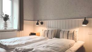 Postel nebo postele na pokoji v ubytování Hotel Marie
