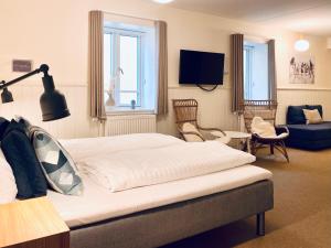 Postel nebo postele na pokoji v ubytování Hotel Marie