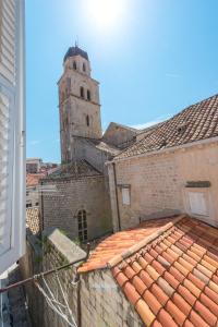 a view of a building with a clock tower at Old Writer Apartment in Dubrovnik