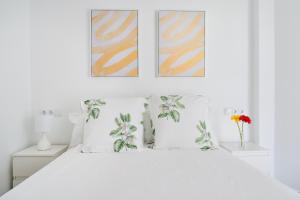 Posteľ alebo postele v izbe v ubytovaní Apartamento en primera linea de playa en la Malagueta