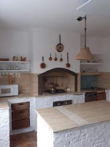 a kitchen with a counter and a stove top oven at Willa Bawarczyk in Istebna