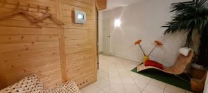 a room with two chairs and a wooden wall at Hotel Prox in Arnstadt