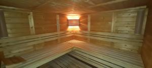 a inside of a wooden sauna with a window at Hotel Prox in Arnstadt