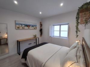 A bed or beds in a room at Apartamento en Alicante La Casa Azul