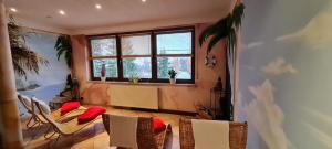 a dining room with a table and chairs and a window at Hotel Prox in Arnstadt