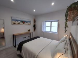 A bed or beds in a room at Apartamento en Alicante La Casa Azul
