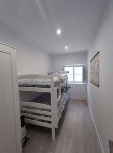 A bed or beds in a room at Apartamento en Alicante La Casa Azul