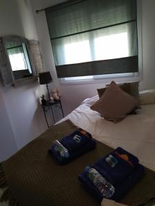 A bed or beds in a room at reina sofia 45