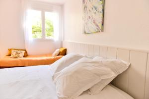 Cama ou camas em um quarto em L’appartement - Jardin Secret