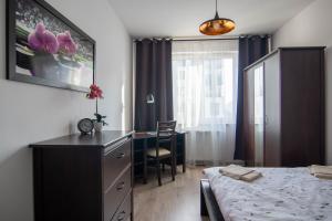 Postel nebo postele na pokoji v ubytování Apartament Loftowy Wypoczynek GoldAir