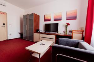 TV a/nebo společenská místnost v ubytování Hotel Color
