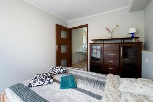 Posteľ alebo postele v izbe v ubytovaní Apartamenty Gdynia