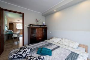 Posteľ alebo postele v izbe v ubytovaní Apartamenty Gdynia