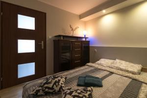 Posteľ alebo postele v izbe v ubytovaní Apartamenty Gdynia