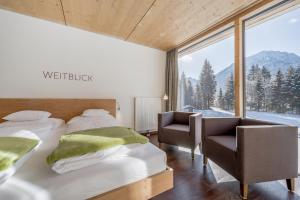 Posteľ alebo postele v izbe v ubytovaní Hotel Fischer am See