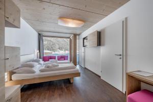 Posteľ alebo postele v izbe v ubytovaní Hotel Fischer am See