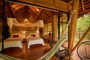 Katil atau katil-katil dalam bilik di Bosque Guardian Lodge