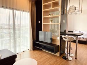 a living room with a table and a television in a room at Dream Suite 2 - Landmark Residence 1, High Floor, Nice view, Wi-Fi & Tv Box in Kajang +23 photos