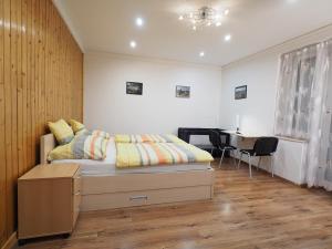 Ένα ή περισσότερα κρεβάτια σε δωμάτιο στο Pajger Apartman