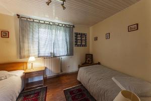 Postel nebo postele na pokoji v ubytování Gîte La Glycine