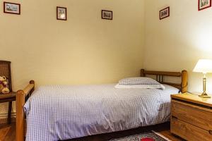Postel nebo postele na pokoji v ubytování Gîte La Glycine