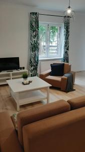 Televízia a/alebo spoločenská miestnosť v ubytovaní Stodoła HOME&CHILL