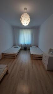 Posteľ alebo postele v izbe v ubytovaní Stodoła HOME&CHILL