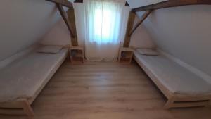 Posteľ alebo postele v izbe v ubytovaní Stodoła HOME&CHILL