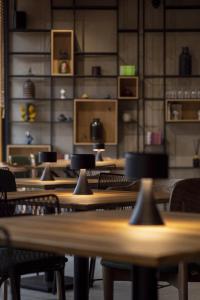a row of tables and chairs in a room at Hotel COTA1110 in Beli Iskar +49 photos