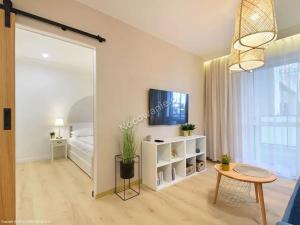 Televízia a/alebo spoločenská miestnosť v ubytovaní Apartament Premium IV z Garażem