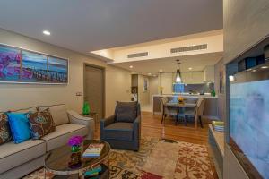a living room with a couch and a table at Ascott Sentral Kuala Lumpur in Kuala Lumpur