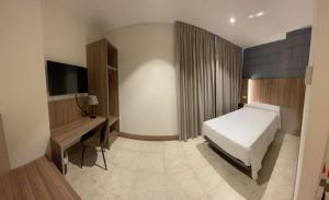 Postel nebo postele na pokoji v ubytování Hotel Camino Real