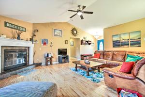 a living room with a couch and a fireplace at Lake Michigan Gem Less Than Half Miles to Private Beach! in Mears