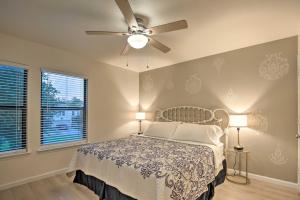 a bedroom with a bed with a ceiling fan at Renovated San Marcos Home with Grill Less Than 1 Mi to TSU! in San Marcos