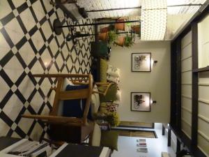 a room with a checkered wall at Abode Bombay in Mumbai