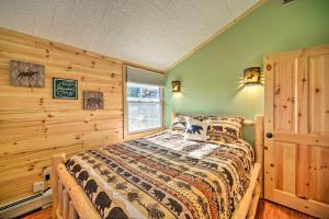 A bed or beds in a room at Cozy Speculator Cottage about 2 Miles to Ski Resort!