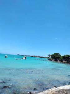 a view of a beach with boats in the water at Idyllic Villa in Pereybere with Private Pool in Pereybere