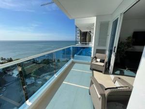 a balcony of a house with a view of the ocean at Reserva del Mar, Hermoso lugar de Descanso en Santa Marta in Gaira