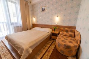 Łóżko lub łóżka w pokoju w obiekcie Pensjonat Mikołajki