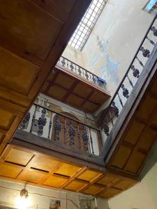 a building with a balcony with a window at Freska Apartments in Lviv