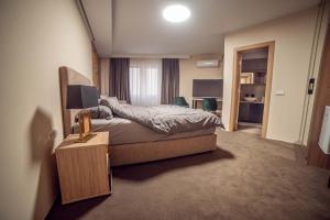 Postel nebo postele na pokoji v ubytování SZUR Home