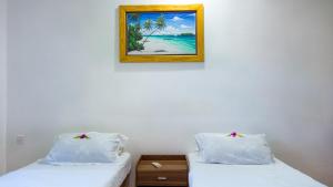 Postel nebo postele na pokoji v ubytování Malas Island View