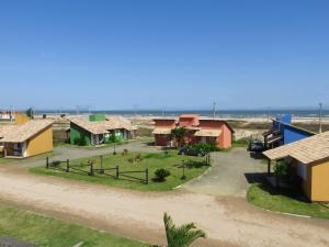 an aerial view of a village next to the beach at Pousada dos Sambaquis in Jaguaruna