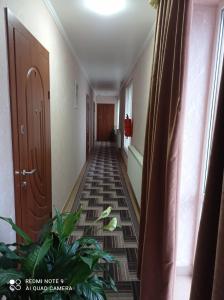 an empty hallway with plants in a building at VIZIT in Stryi