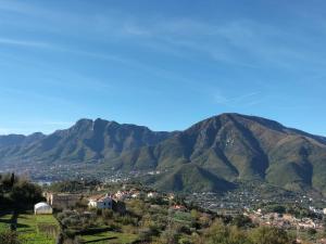 a mountain view of a town in front of mountains at Casa Lamberti B&B in Cava deʼ Tirreni