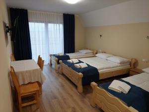 Posteľ alebo postele v izbe v ubytovaní Willa u Polczyków