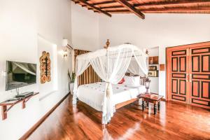 a bedroom with a bed and a dresser at Waterland in Negombo