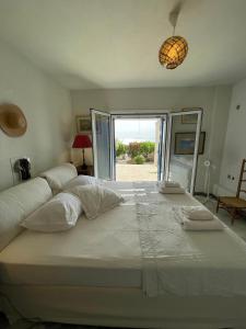 Postel nebo postele na pokoji v ubytování Cape Sunset Villa