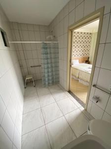 Ванная комната в Coral Palace Hotel