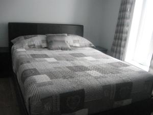 מיטה או מיטות בחדר ב-Gite la Maison Rochefort